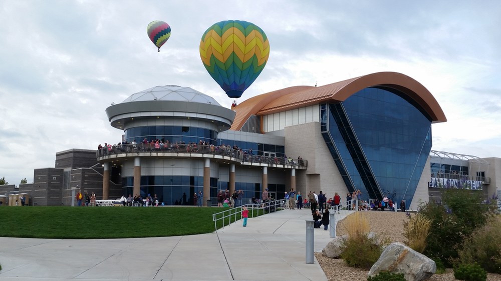 Balloons take flight above the Balloon Museum.