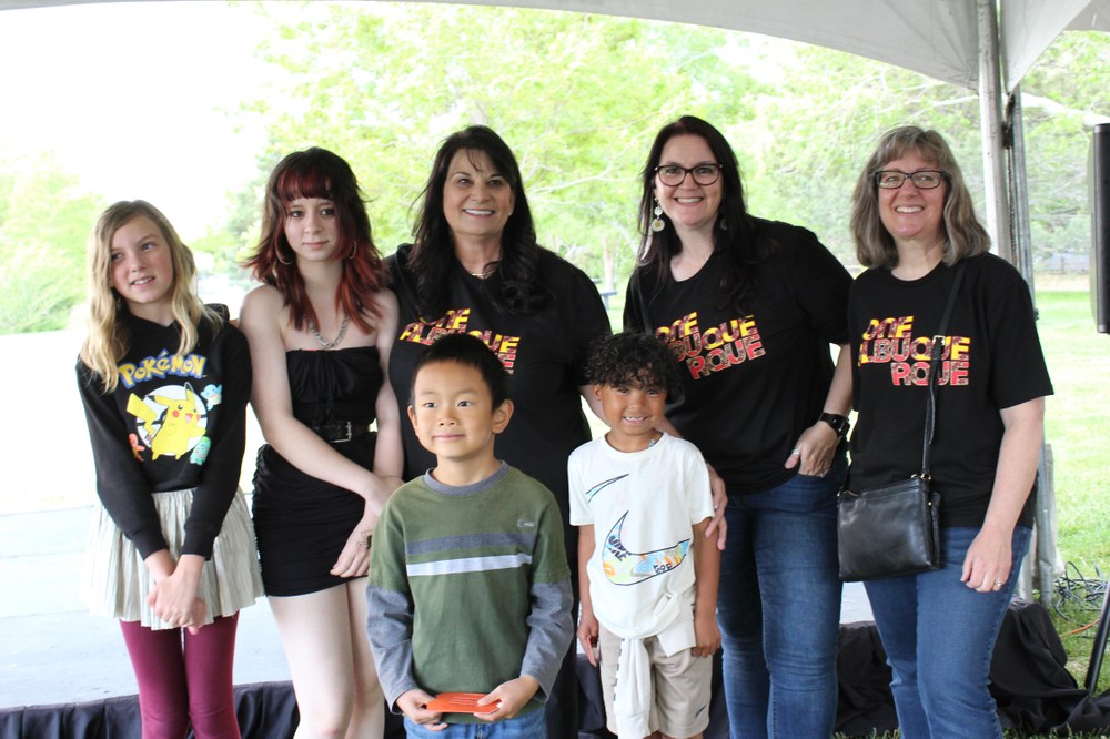 Councilor Grout, Natasha Baca, and Rachel Miller with the youth art contest prize winners